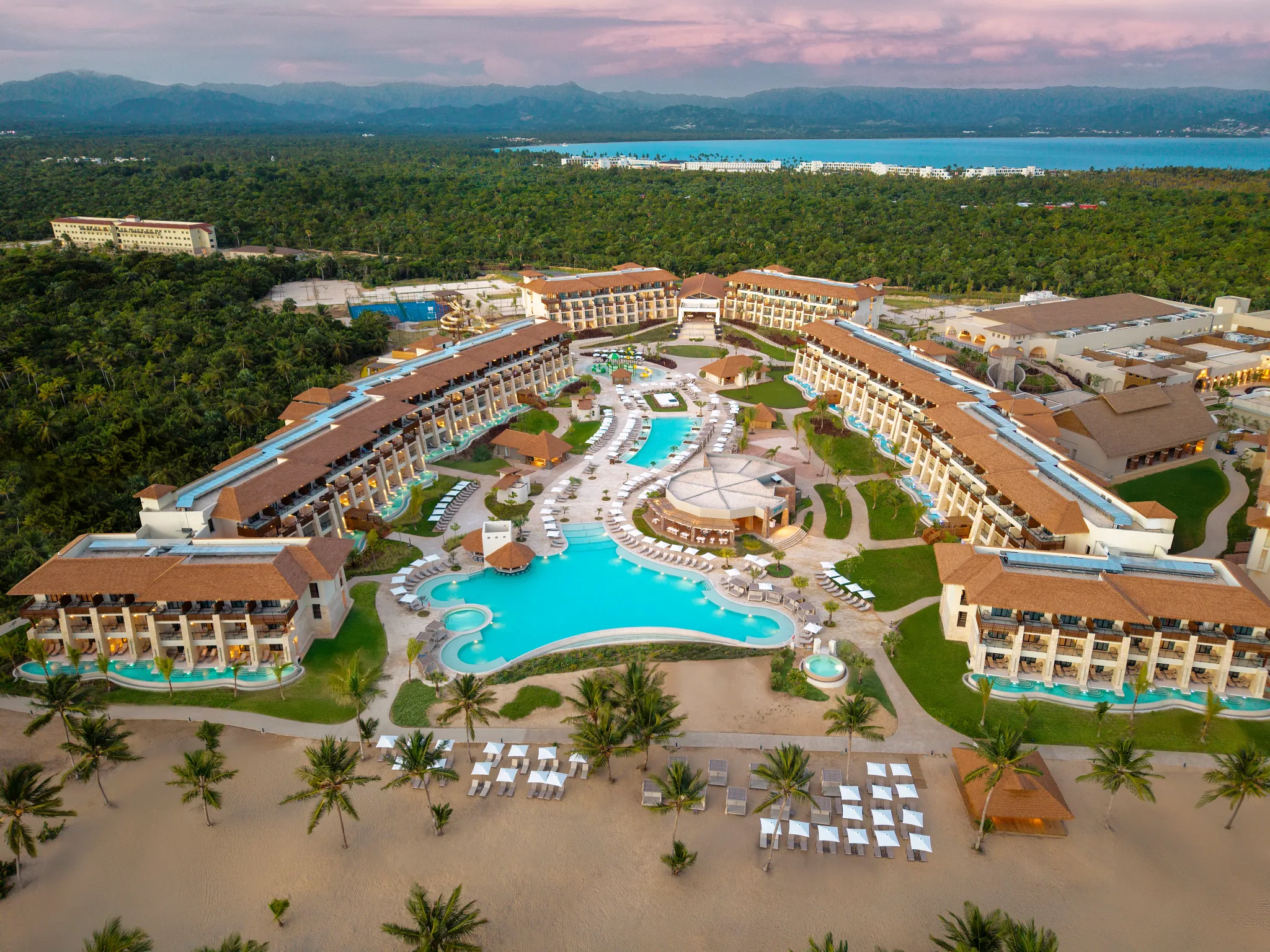 Aerial overview of Dreams Playa Esmeralda Resort & Spa featuring pools, beachfront suites, and tropical landscapes.