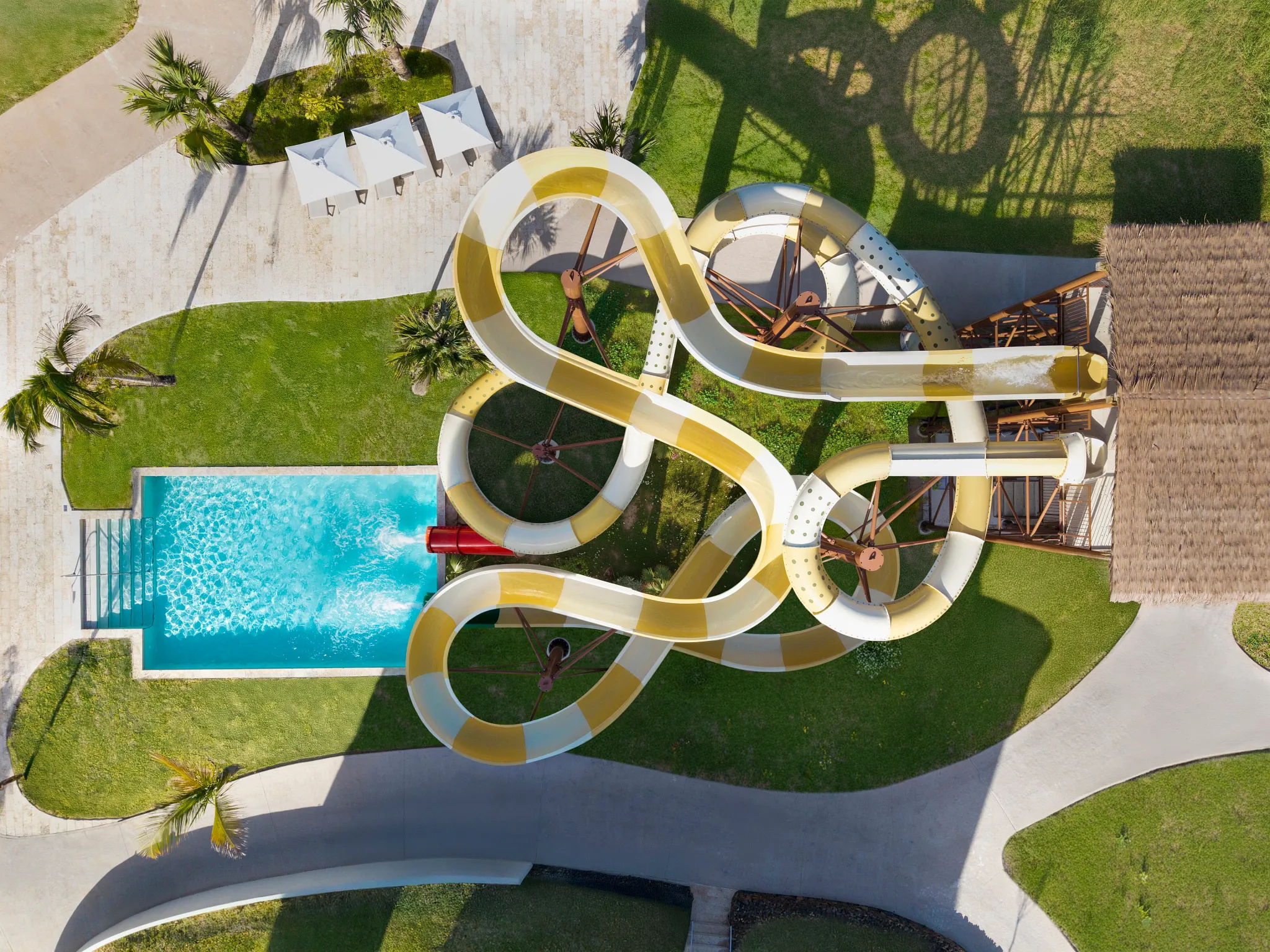 Overhead aerial view of the waterslides and splash pool at Dreams Playa Esmeralda Resort & Spa.
