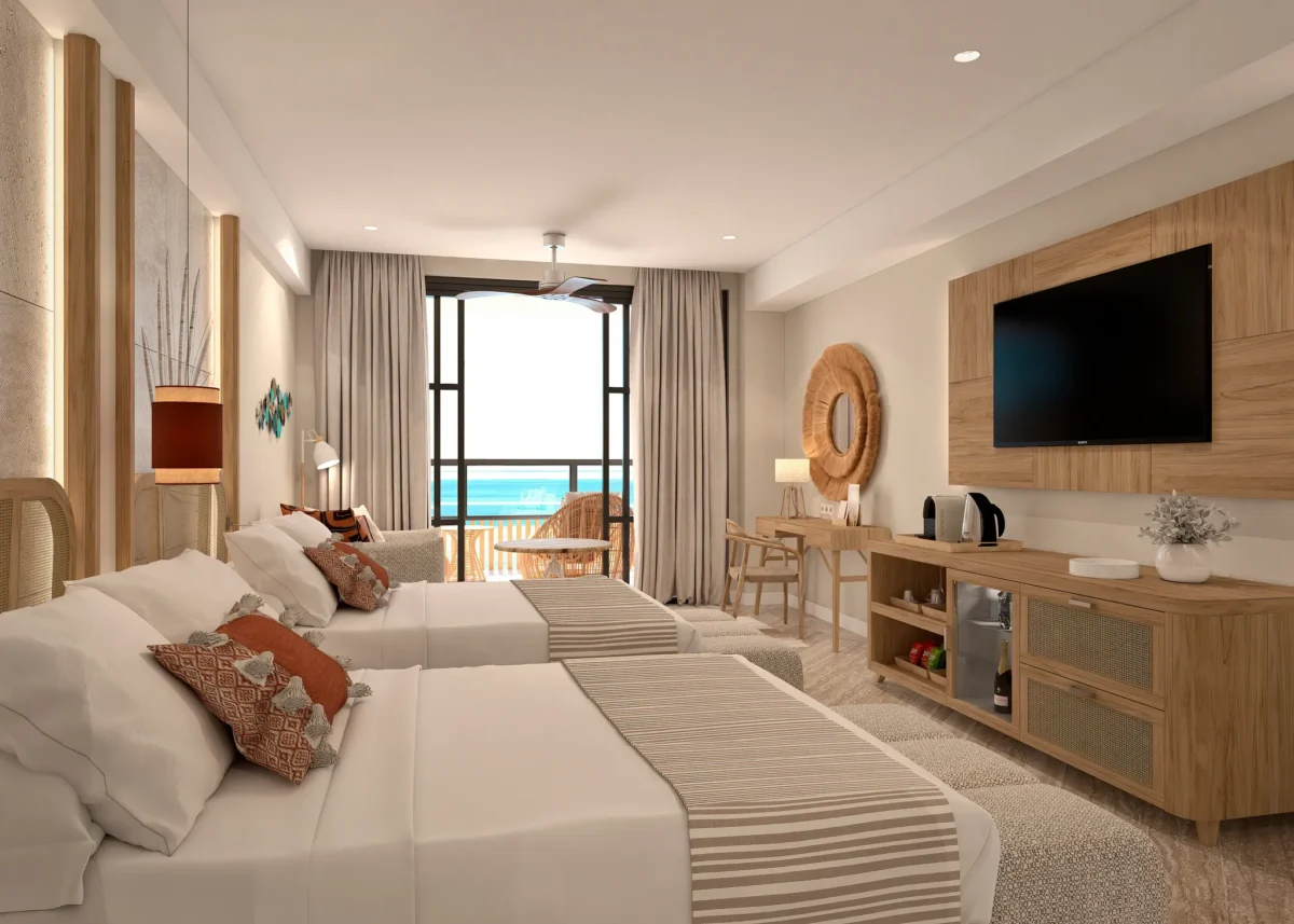 Junior Suite Ocean View with double beds and furnished balcony at Dreams Playa Esmeralda Resort & Spa.