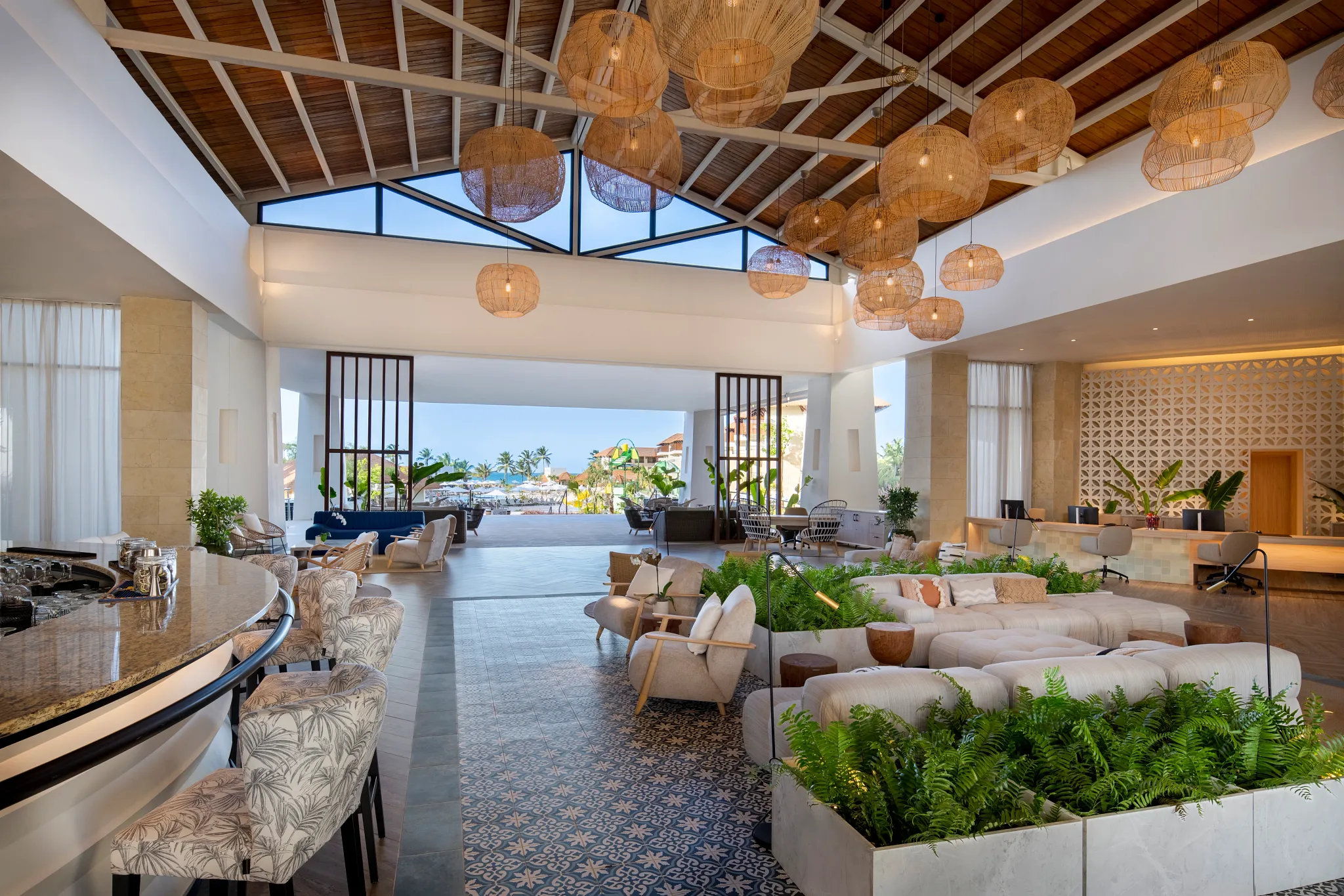 Elegant open-air lobby with tropical décor at Dreams Playa Esmeralda Resort & Spa in the Dominican Republic.