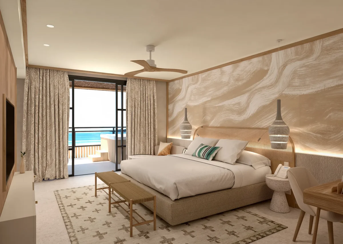 Preferred Club Junior Suite Ocean View with king bed and private furnished balcony at Dreams Playa Esmeralda Resort & Spa.