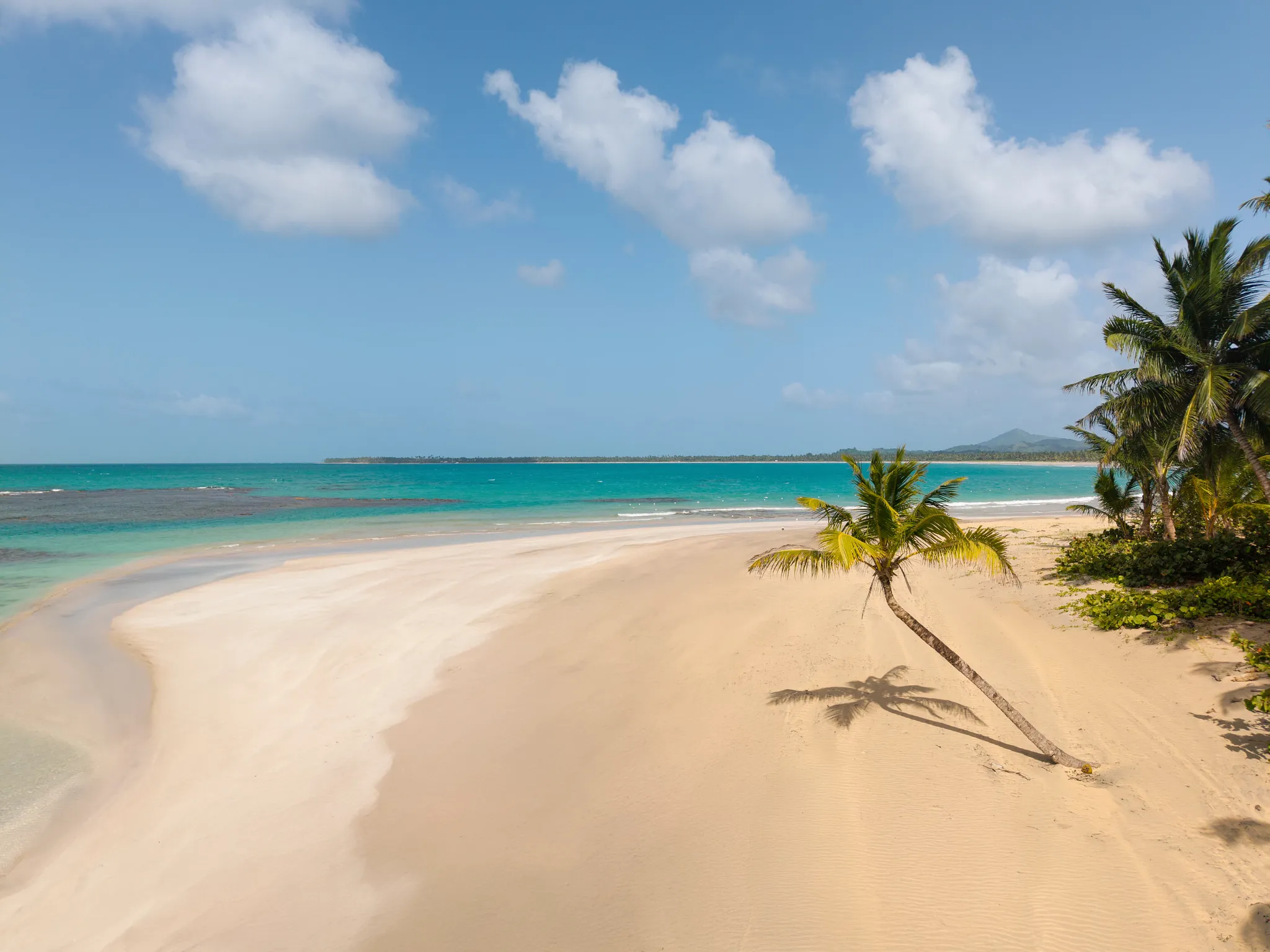Peaceful tropical beach with soft white sand and turquoise water near Dreams Playa Esmeralda Resort & Spa.