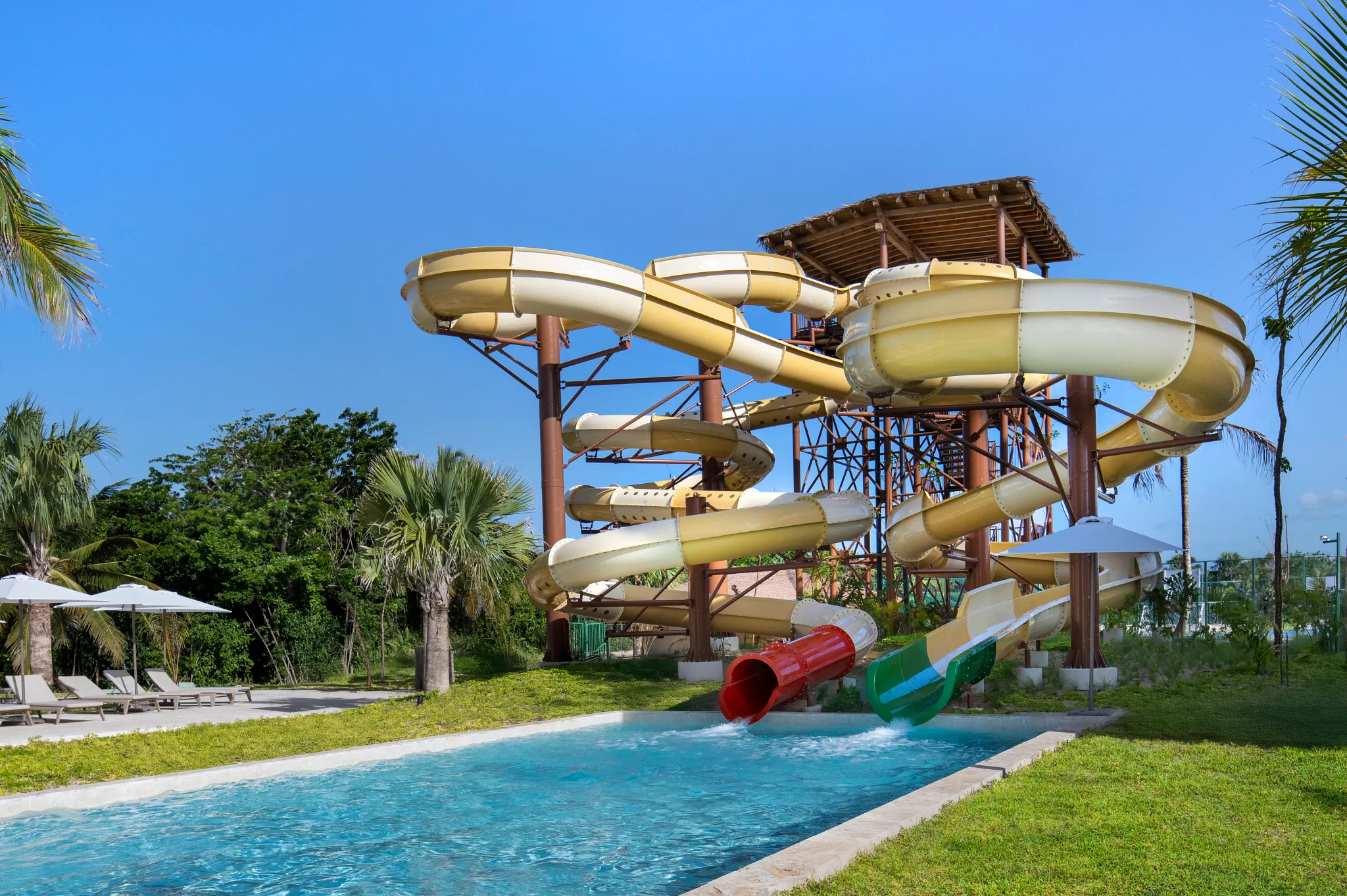 Large waterslides and splash pool at Dreams Playa Esmeralda Resort & Spa, offering family-friendly fun in the Dominican Republic.